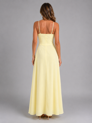 Side view showing the flowing maxi-length skirt and fitted bodice