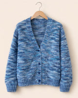 Close-up of the striped knit pattern and open-front detail of the cardigan