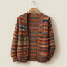 Front view of a striped knit open-front cardigan with long sleeves