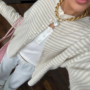 Close-up of stand collar detail on striped button-front cardigan