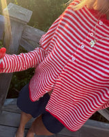 Back view of women's striped knit cardigan