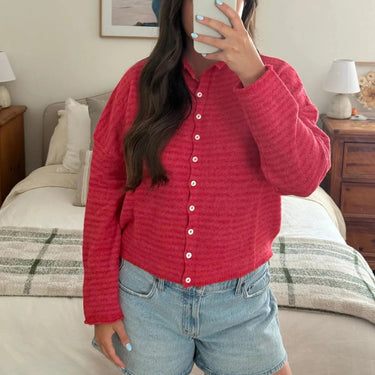 Striped cardigan styled open over a casual outfit