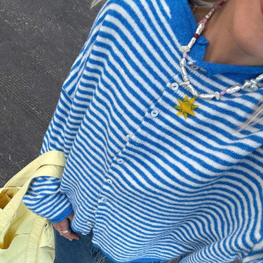 Close-up of horizontal stripe pattern on knit cardigan