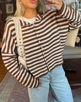 Front view of women's striped knit cardigan with stand collar and button front