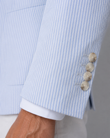 Close-up of the seersucker stripe texture and notch lapel detail