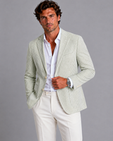 Model wearing the striped blazer styled for a smart summer occasion