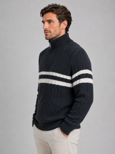 Full-length shot of the men's cable-knit jumper styled with trousers and boots