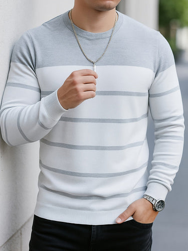 Men's striped jumper shown layered over a shirt, three-quarter view
