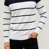 Close-up of ribbed crew neck and stripe detail on men's fine knit jumper