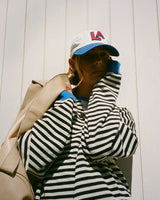 Full-length view of the striped jumper styled with jeans
