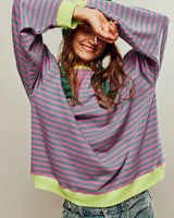 Side view of the striped jumper showing the relaxed silhouette