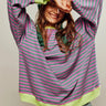 Side view of the striped jumper showing the relaxed silhouette