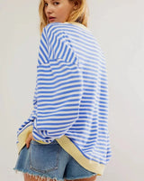 Back view of the striped jumper in light blue