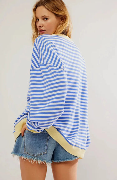 Back view of the striped jumper in light blue
