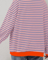 Detail shot of the hem and body width of the loose-fit jumper