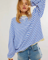 Front view of a striped loose-fit jumper in green and pink