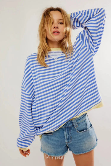 Front view of a striped loose-fit jumper in green and pink