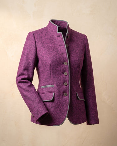Front view of a structured blazer jacket with contrast trim at collar and cuffs