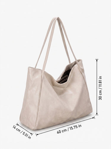 Tote bag carried on the shoulder of a model