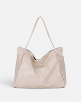 Front view of a structured faux leather tote bag with long shoulder straps
