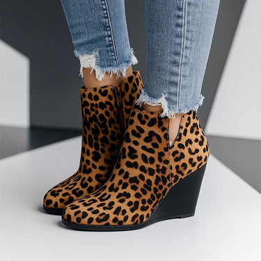 Rear view of suede wedge ankle boots showing heel height and ankle shaft