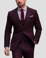 Close-up of the blazer's notch lapels and buttoned front on the three-piece suit
