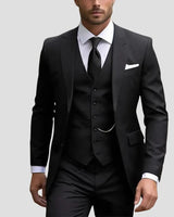 Side view of the tailored three-piece suit showing the fitted silhouette and trouser line