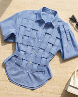 Close-up of the pointed collar and top button detail