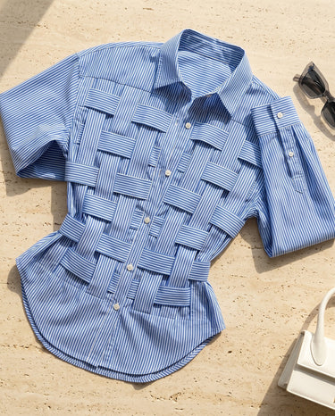 Close-up of the pointed collar and top button detail