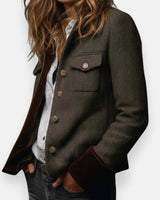 Side view showing the tailored silhouette of a quilted herringbone tweed jacket