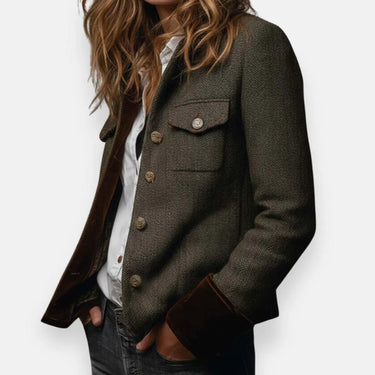 Side view showing the tailored silhouette of a quilted herringbone tweed jacket