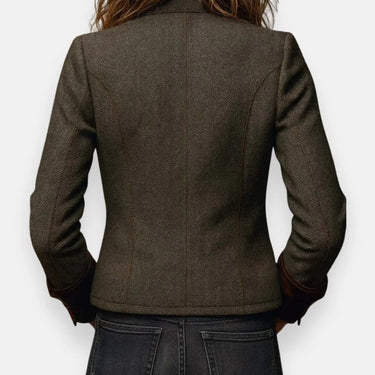 Close-up of flap chest pockets on a structured quilted tweed jacket