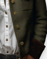 Detail shot of velvet-trimmed cuffs on a quilted tweed jacket