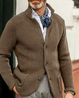 Close-up of the four-button front fastening and stand collar detail