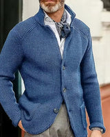 Men's cardigan styled with tailored trousers, full-length view