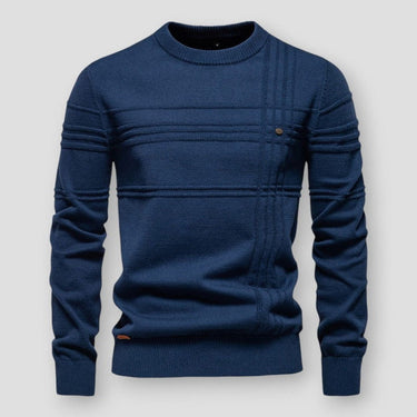 Close-up of the raised knit detailing on the front of a crew neck jumper