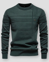 Detail shot of the ribbed cuffs and neckline on a textured crew neck jumper