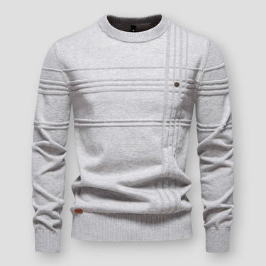 Side view of a textured crew neck jumper showing ribbed hem and long sleeves