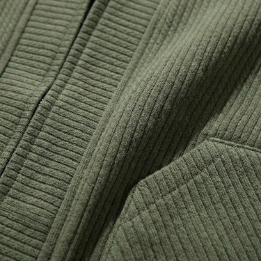 Close-up of front patch pockets on men's textured cardigan