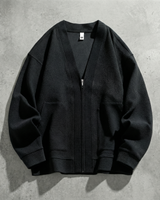 Front view of men's textured zip-up cardigan with V-neck and patch pockets