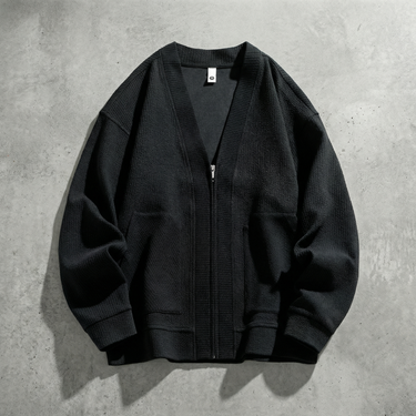 Front view of men's textured zip-up cardigan with V-neck and patch pockets