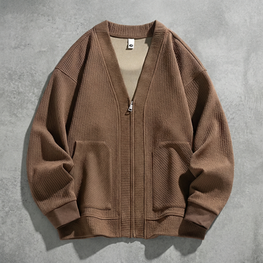 Three-quarter view showing zip closure and long sleeves of men's cardigan