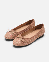 Side profile of a flat tweed shoe showing the woven fabric texture