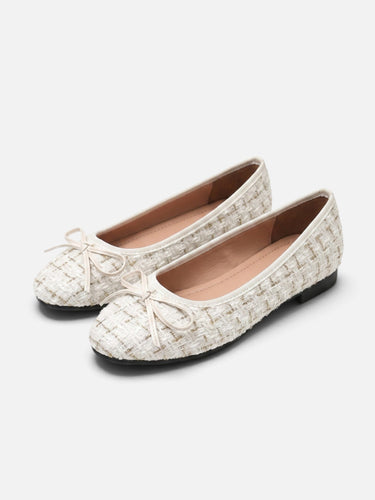 Close-up of the bow detail on the toe of the ballet flat
