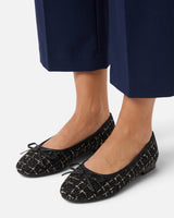 Styled shot of the tweed ballet flat worn with tailored trousers