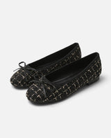 Front view of a tweed ballet flat with a bow at the toe