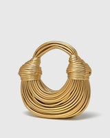 Side profile of the hoop bag showing the rigid frame and twisted exterior detail