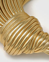 Close-up of the multi-layered twisted panel on the front of the hoop bag