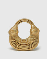 Front view of a structured twisted hoop bag with a layered circular design