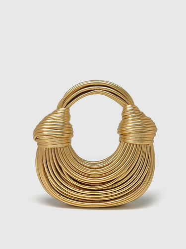 Front view of a structured twisted hoop bag with a layered circular design
